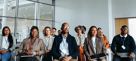 Delegates seated at a Machipu training session